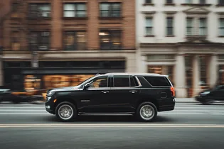 A black SUV waiting on a New York City street