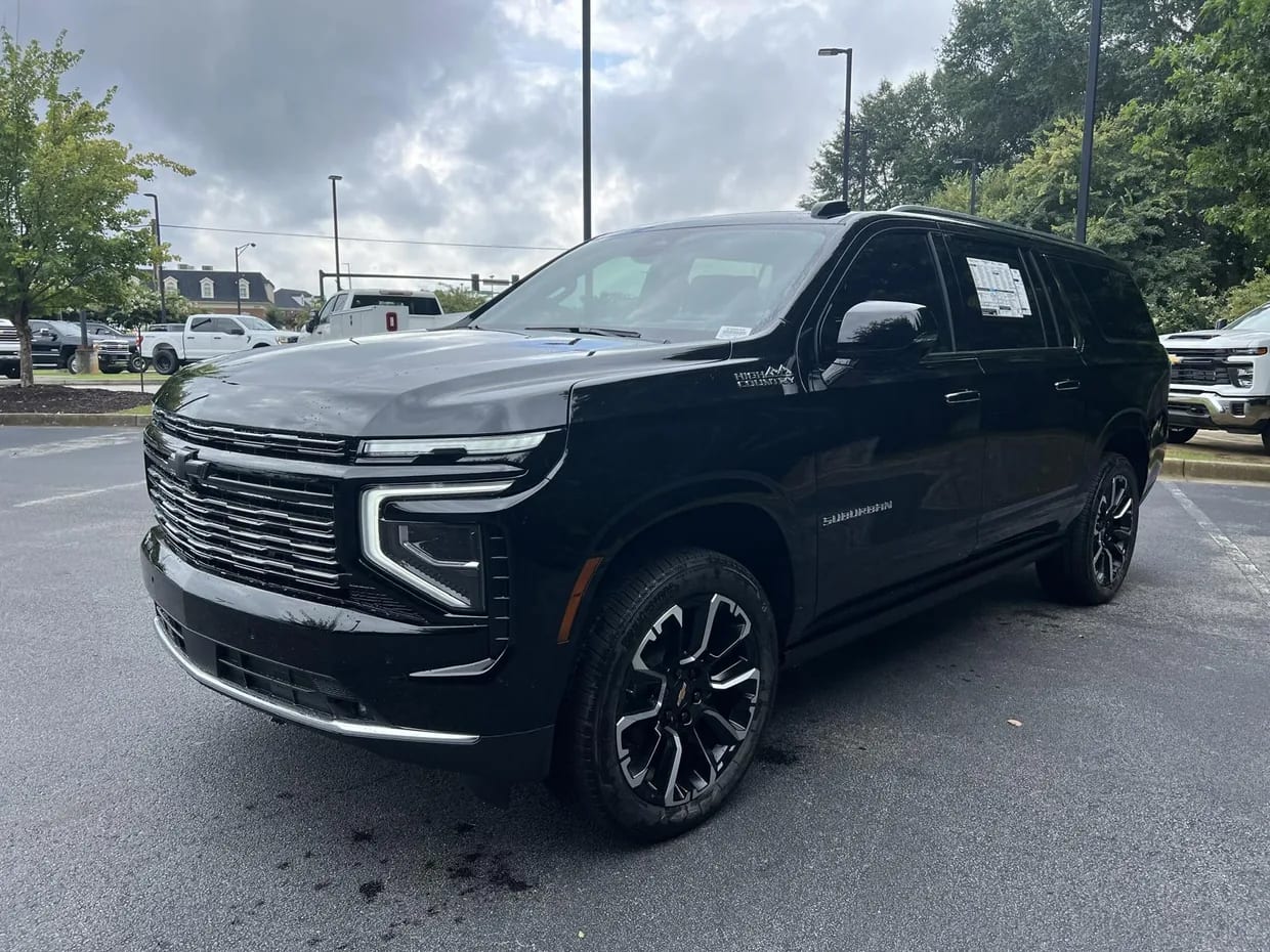 Front three-quarter view of a black Chevrolet Suburban